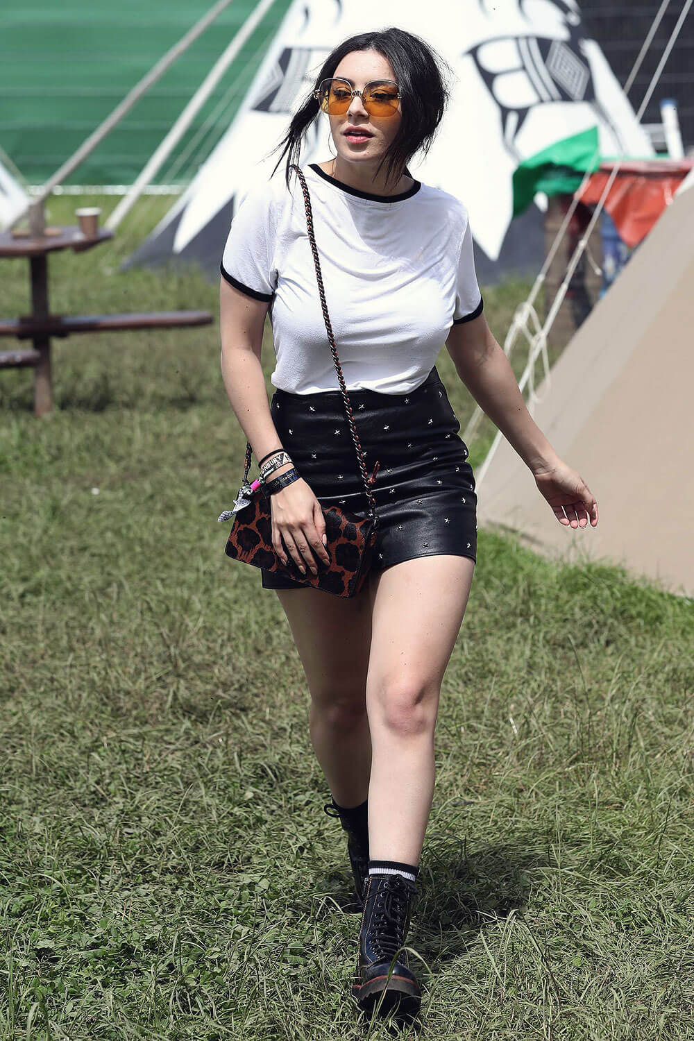 Charlie XCX wearing Coach attends the Glastonbury Festival - Leather