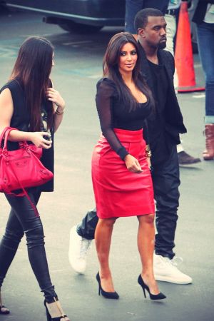 Kim Kardashian arrive at an X-Factor