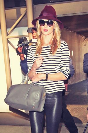 Rosie Huntington-Whiteley is seen at LAX Airport wearing leather leggings