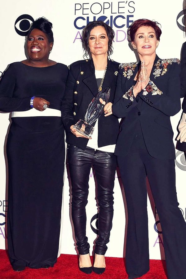 Sara Gilbert pose in the press room at the 2016 People’s Choice Awards