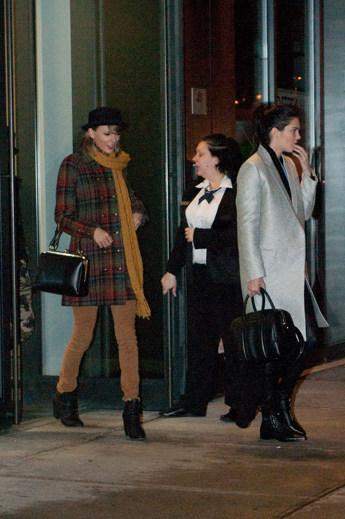 Kendall Jenner, Taylor Swift and Cara Delevingne coming out of Gigi Hadids house